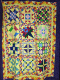 Kisses sampler quilt in bright colors